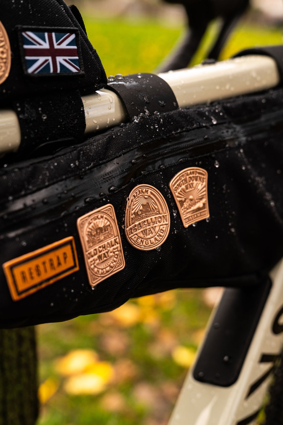 Bikepacking patches lifestyle shot on cycling gear - Trans Cambrian Way patch included