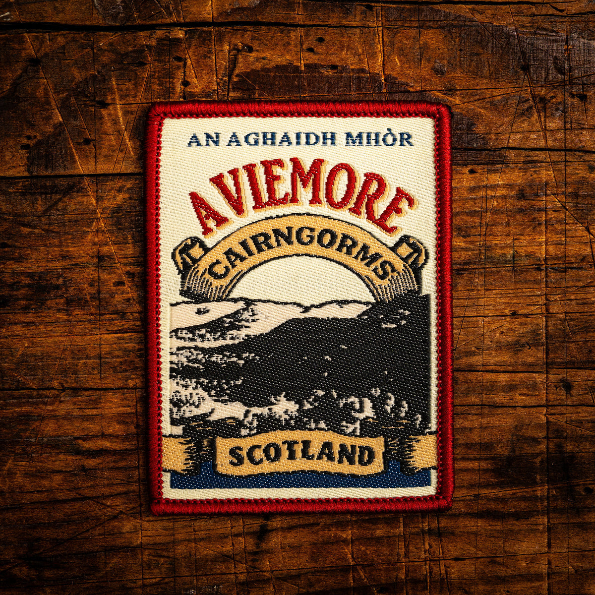 Aviemore retro woven patch – popular outdoor hub in Cairngorms National Park, Scotland, whisky label design