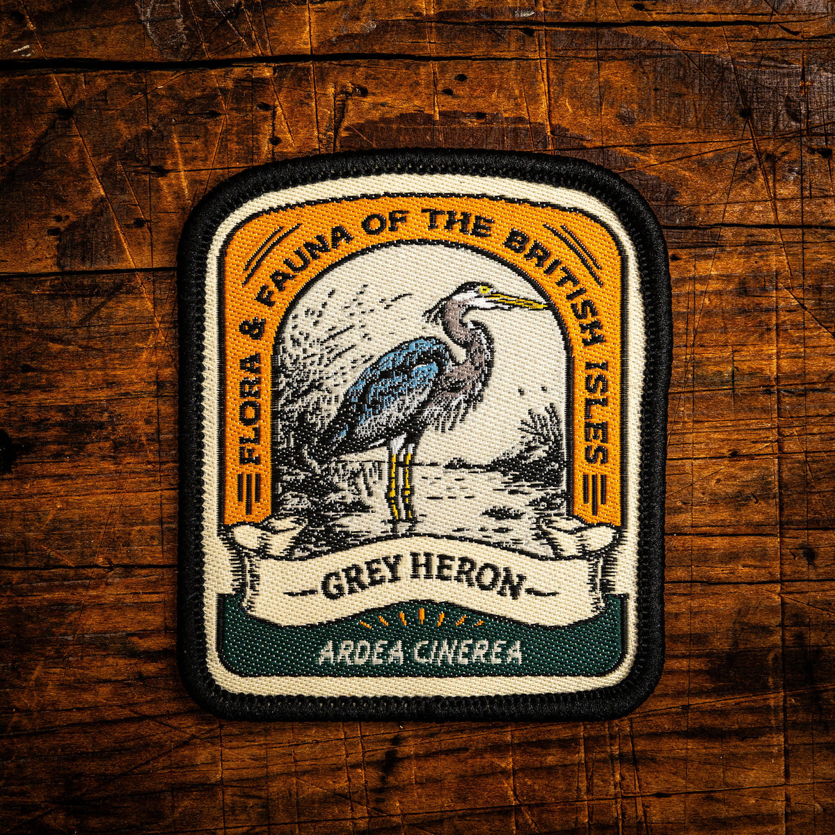 Grey Heron retro woven patch - elegant British wading bird, wildlife patch, iron-on backing, recycled yarn