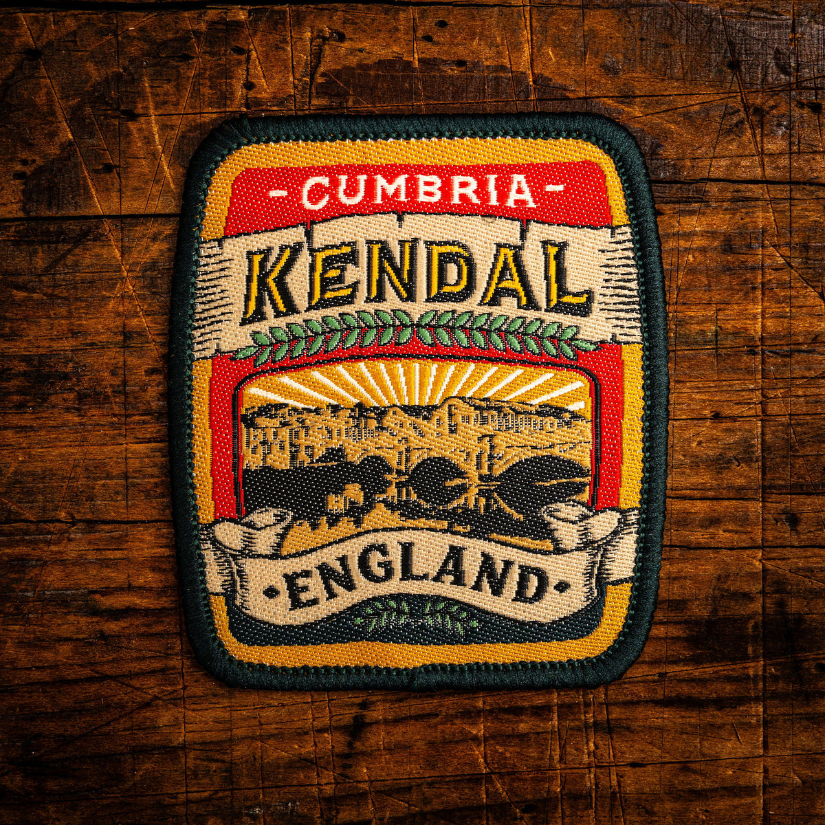 Kendal retro woven patch - historic Lake District market town, beer pump clip design, iron-on backing