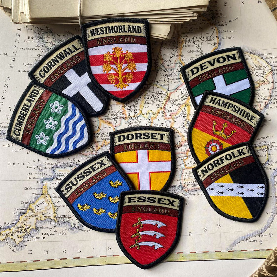 English county flag patches on outdoor gear including Cumberland - retro woven county flag patches