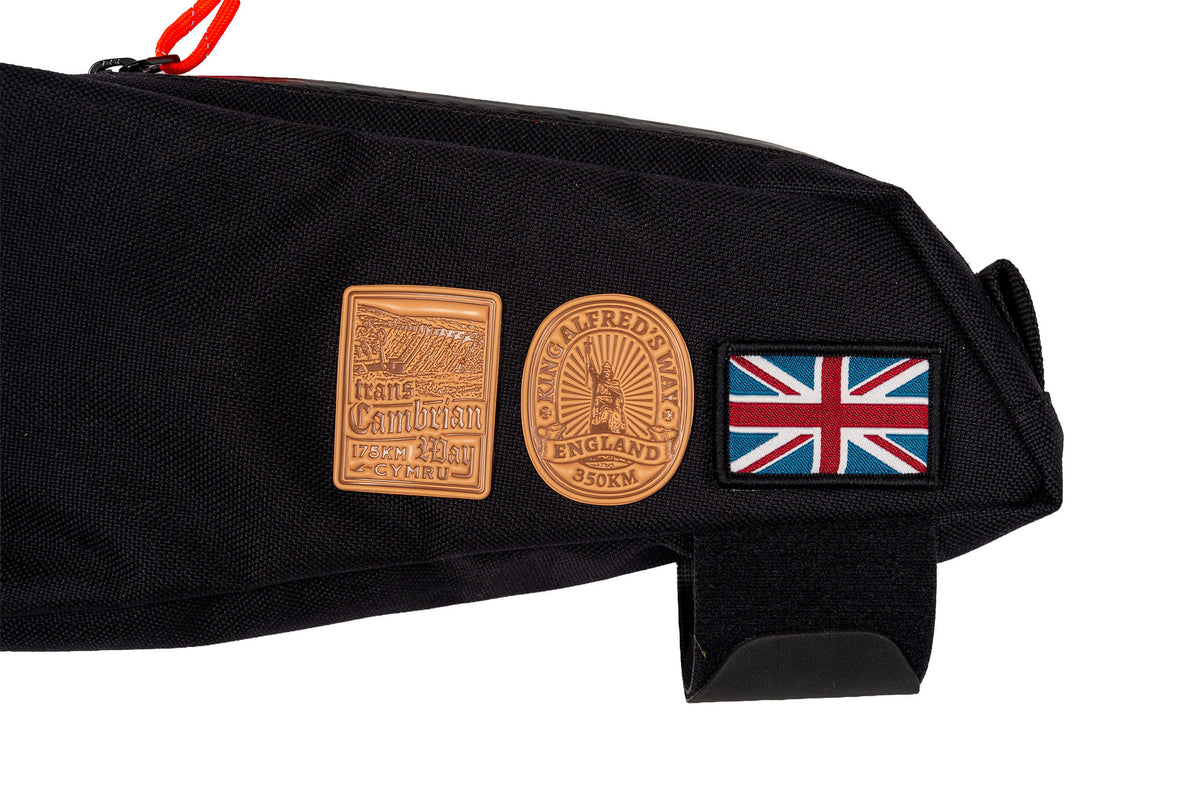 King Alfred's Way bikepacking patch lifestyle shot on cycling gear - retro woven cycling patch