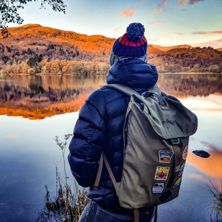 Wainwright completer patch on a rucksack with Lake District patches – retro woven completer patch
