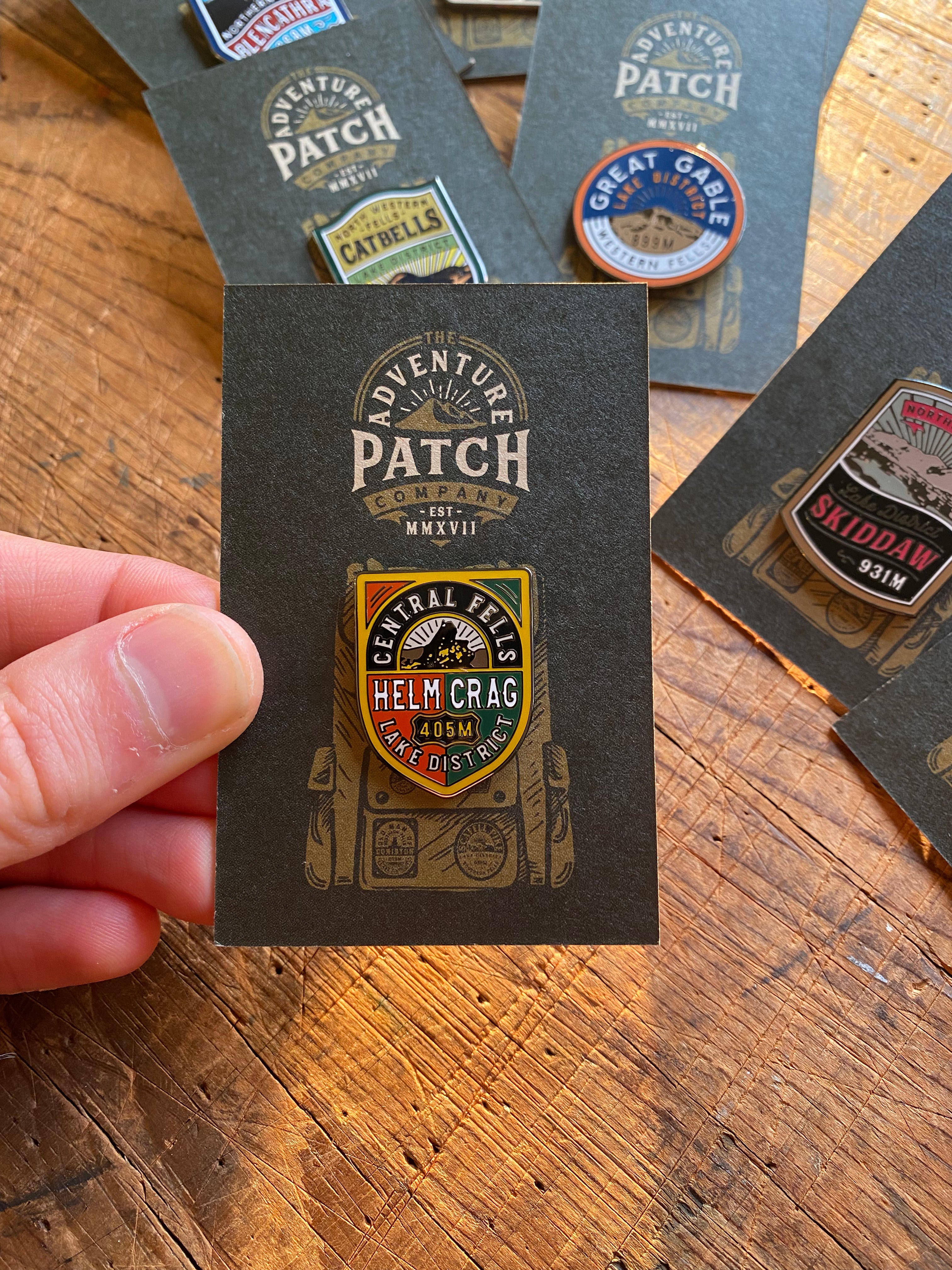 Helm Crag enamel pin displayed on backing card – Lake District Fells hard enamel pin