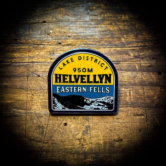 Helvellyn enamel pin in hand – Lake District Fells pins set of five shown up close