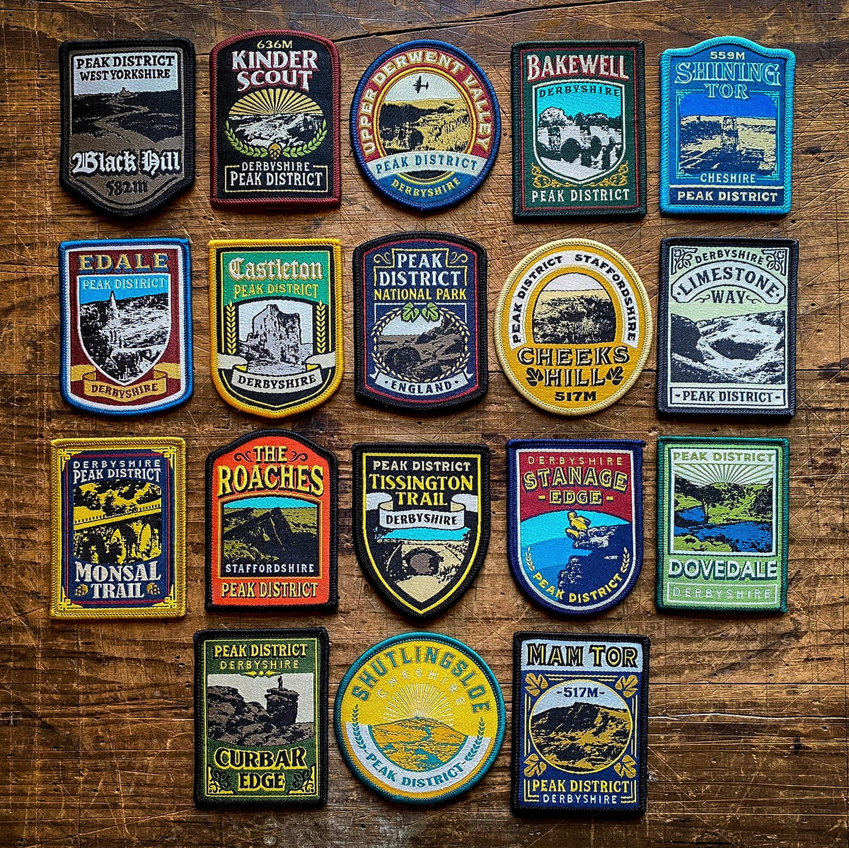 Full set of 18 Peak District patches laid out – Bakewell patch included in collection