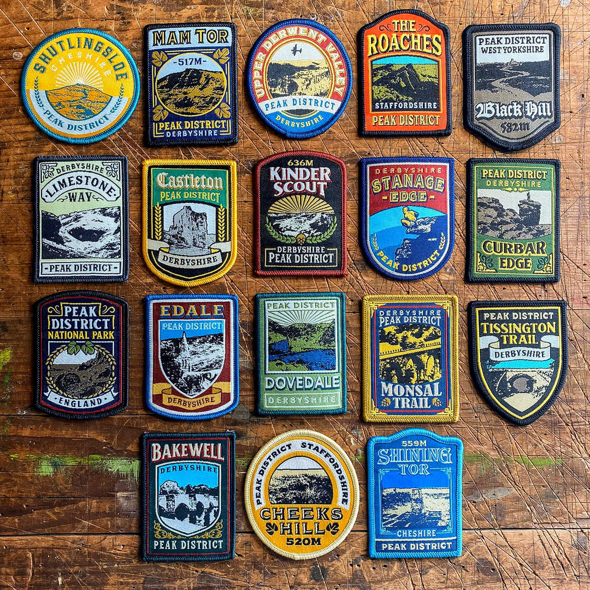Full set of 18 Peak District patches laid out – retro pub sign woven patch collection, £30 saving