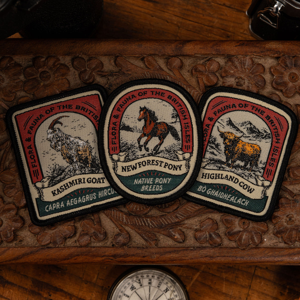 Highland Cow patch close-up on outdoor gear - retro woven Scottish wildlife patch