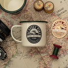 Scafell Pike camp mug lifestyle shot - hard enamel camping mug in outdoor setting