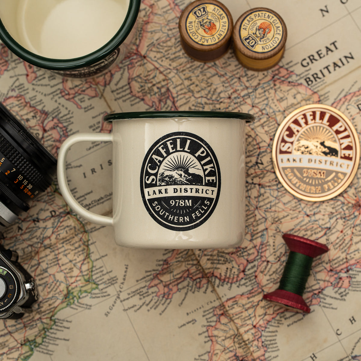 Scafell Pike camp mug lifestyle shot - hard enamel camping mug in outdoor setting