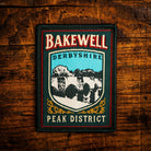 Bakewell retro woven patch – historic market town in Peak District, pub sign design, iron-on backing