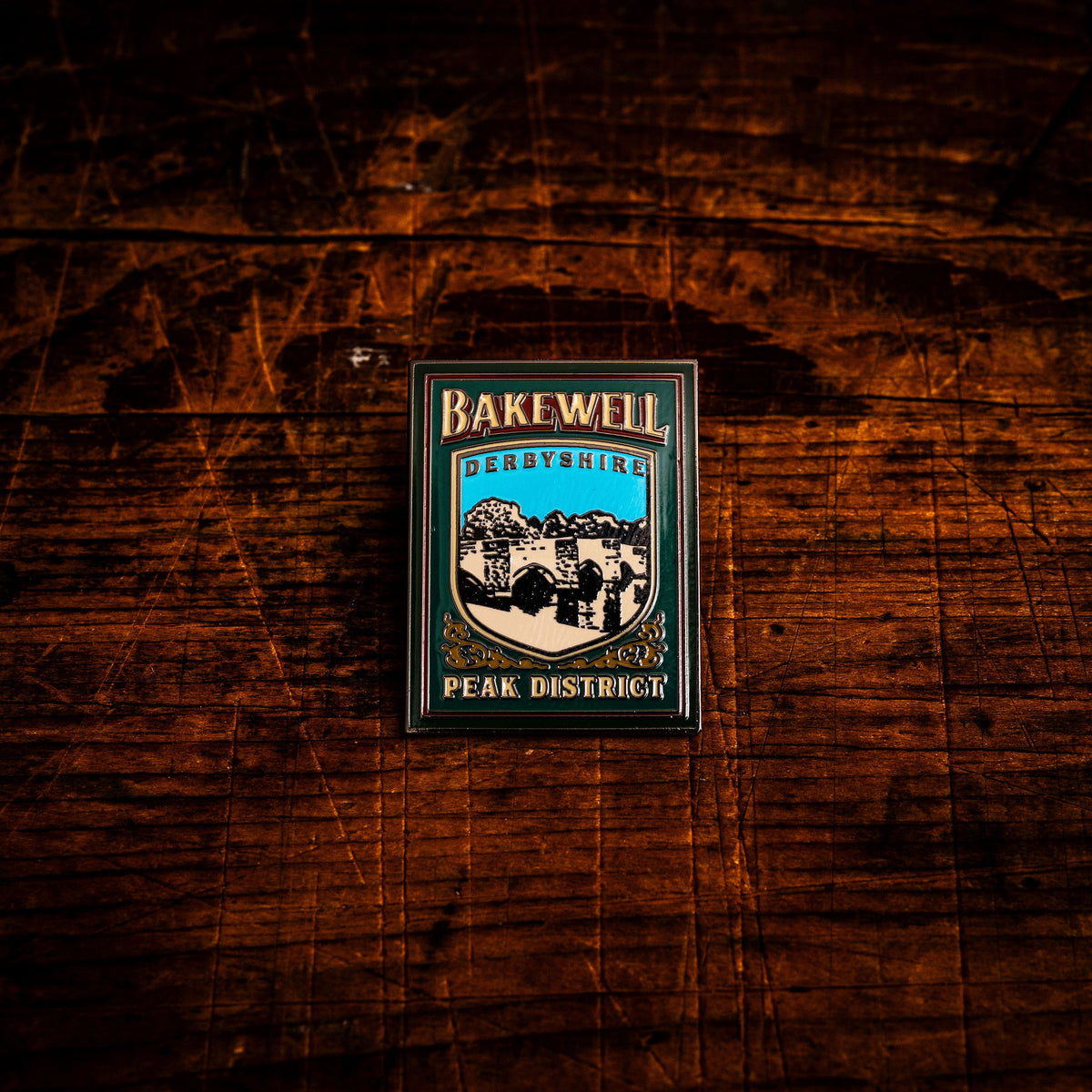 Bakewell hard enamel pin - historic Peak District market town, pub sign design, butterfly clasp