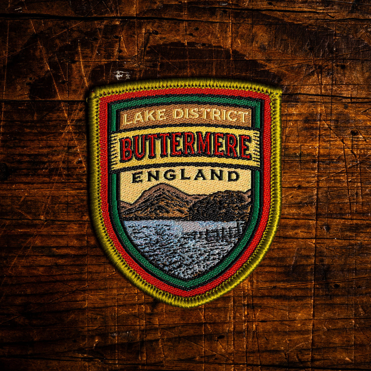 Buttermere retro woven patch - beautiful Lake District lake and village, beer pump clip design, iron-on