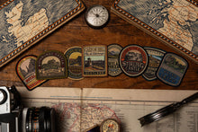 Load image into Gallery viewer, Edinburgh patches lifestyle shot on outdoor gear - retro woven patches collection