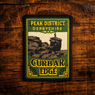 Curbar Edge retro woven patch – gritstone escarpment above Curbar, Peak District, pub sign design