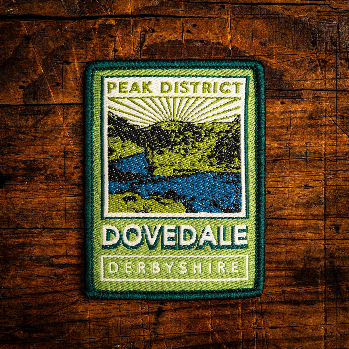 Dovedale retro woven patch – Peak District, pub sign design, iron-on backing, recycled yarn