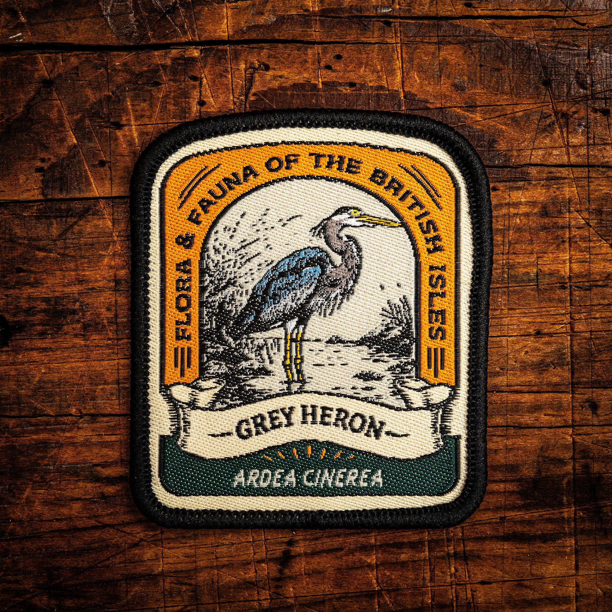 Grey Heron retro woven patch - elegant British wading bird, wildlife patch, iron-on backing, recycled yarn