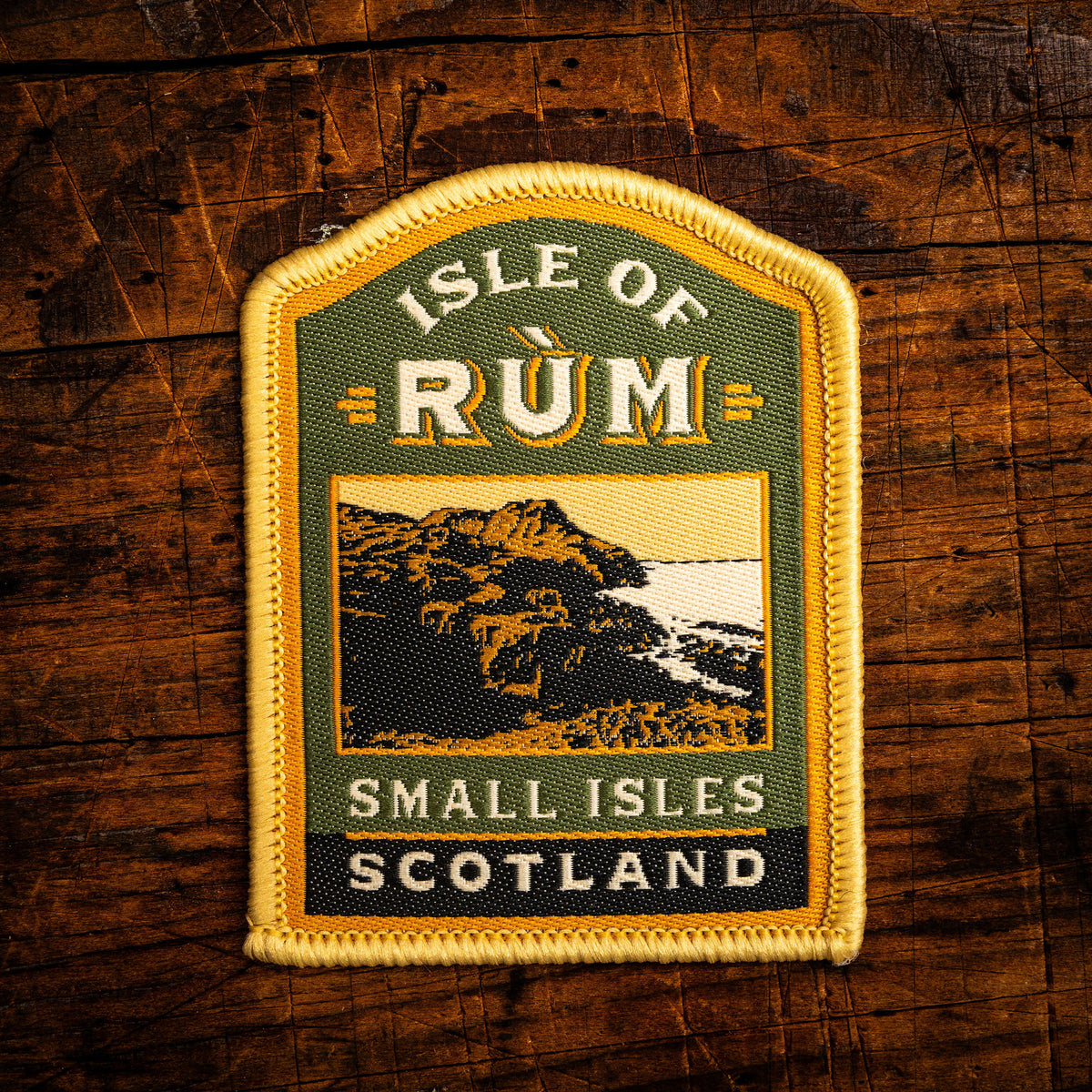 Isle of Rum retro woven patch - remote Scottish island with rugged mountains, whisky label design, iron-on
