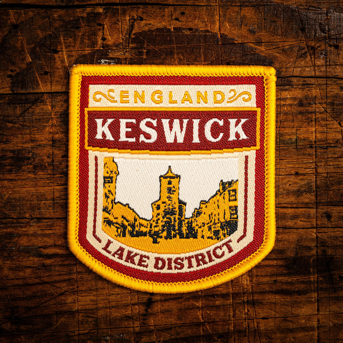 Keswick retro woven patch – historic Lake District market town, beer pump clip design, iron-on backing