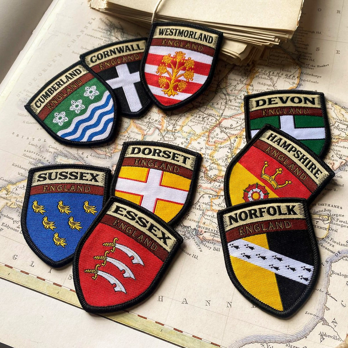 English county flag patches on outdoor gear including Westmorland - retro woven county flag patches