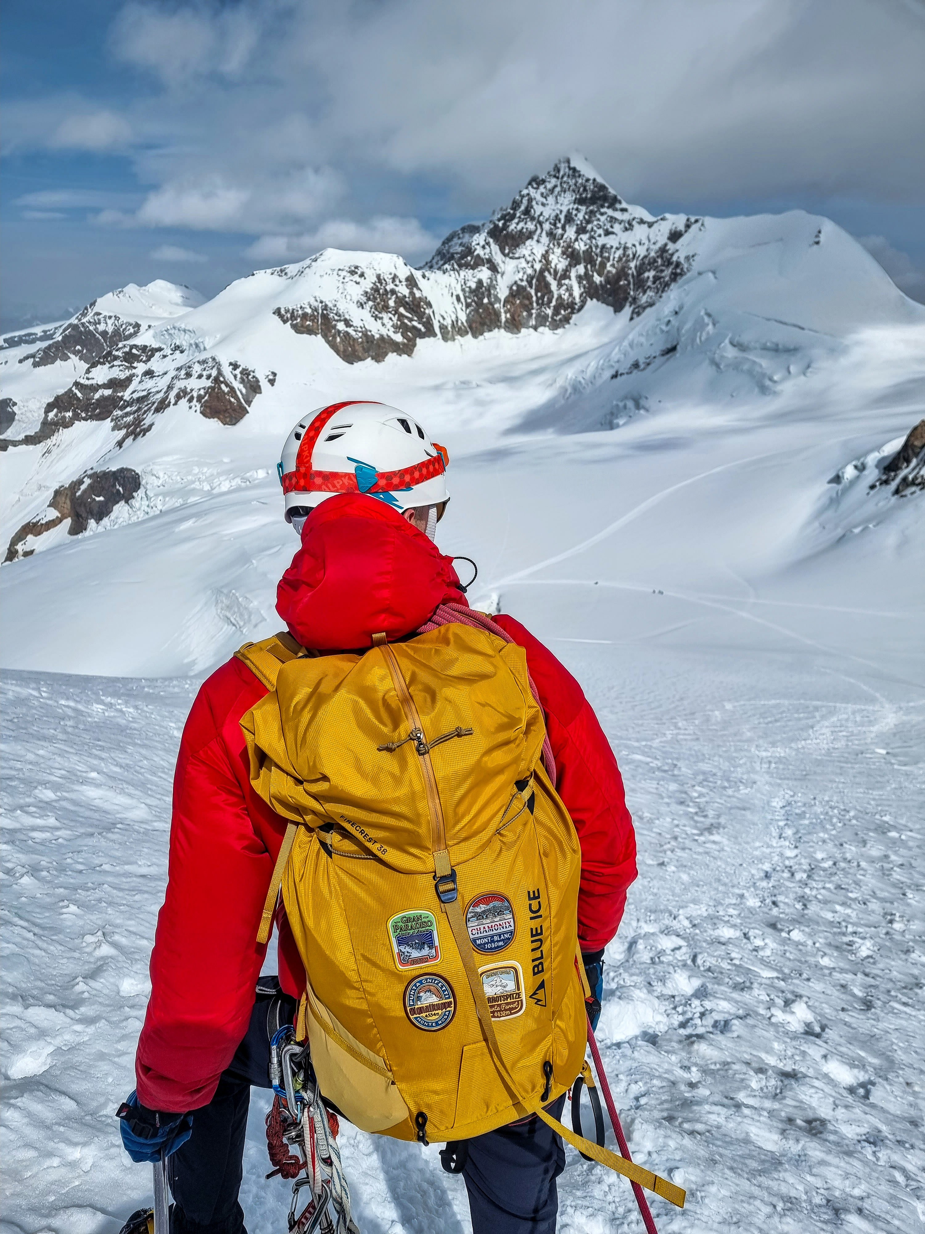 Allalinhorn patch on a rucksack in the mountains – retro woven Alpine patch worn outdoors