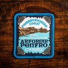 Arfordir Penfro (Pembrokeshire Coast) Celtic design woven patch – Welsh coastal national park, iron-on