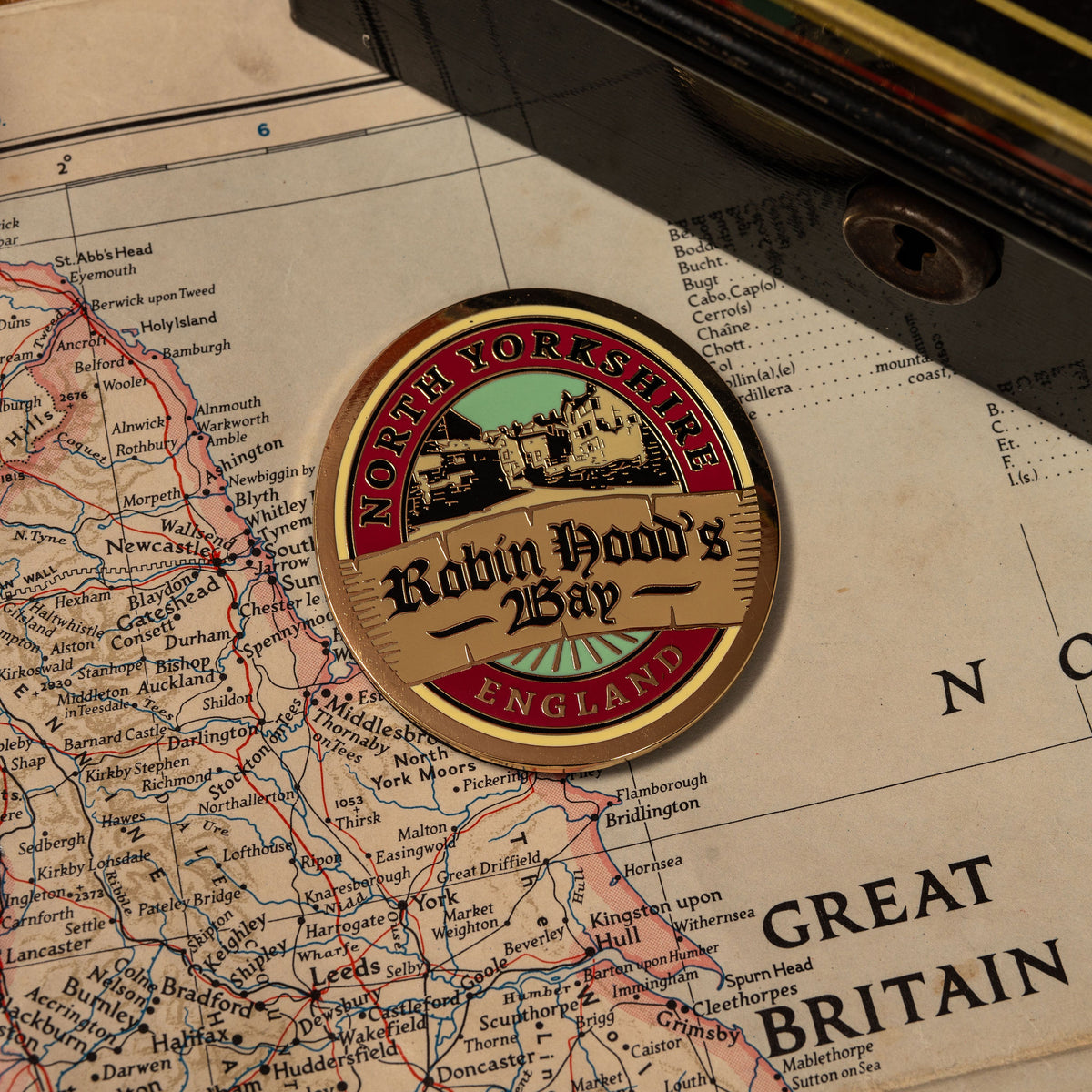 Robin Hood's Bay fridge magnet close-up - hard enamel magnetic keepsake for walkers