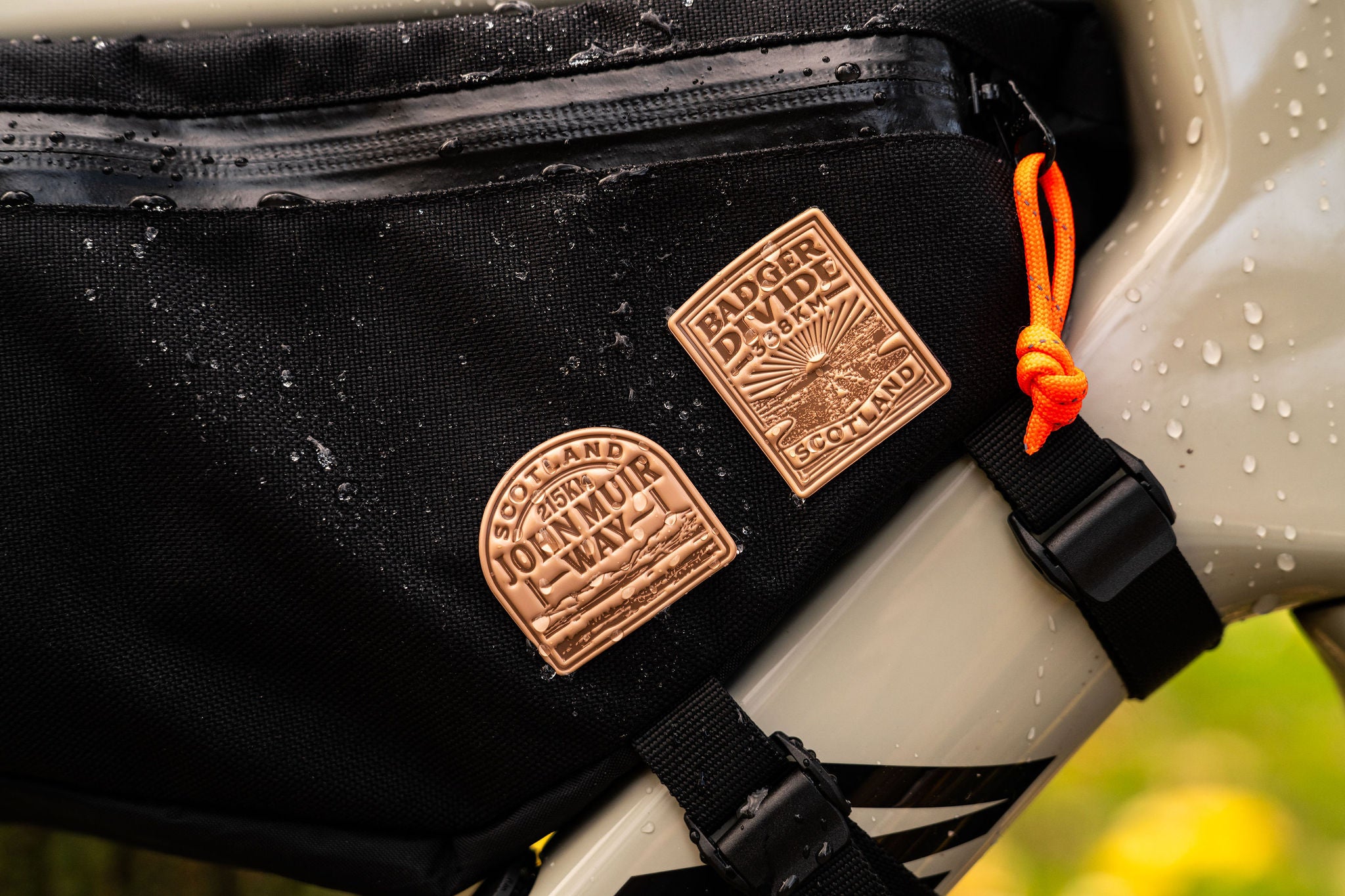 Bikepacking patches including Badger Divide on outdoor gear - retro woven cycling patches
