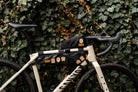 Bikepacking patches group flat-lay - retro woven cycling route patches collection