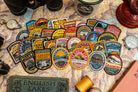 Adventure Patch Company woven patches on outdoor gear – Lake District hiking patch collection