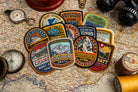 Adventure Patch Company Alps patches hero shot – woven patches on outdoor gear in mountain setting