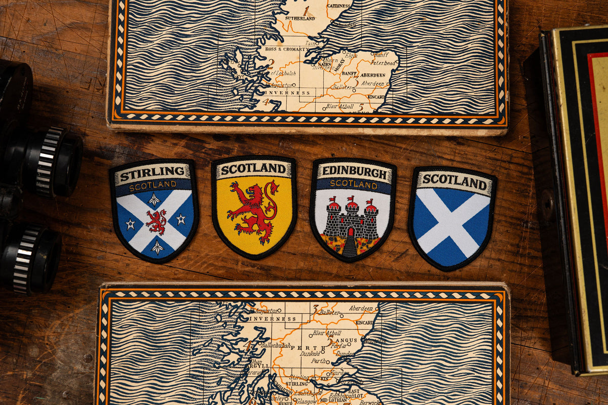 Saltire shield patch lifestyle shot on outdoor gear - retro woven Scottish flag patch