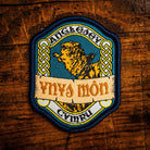 Ynys Mon (Anglesey) Celtic design woven patch – beautiful Welsh island in north Wales, iron-on backing