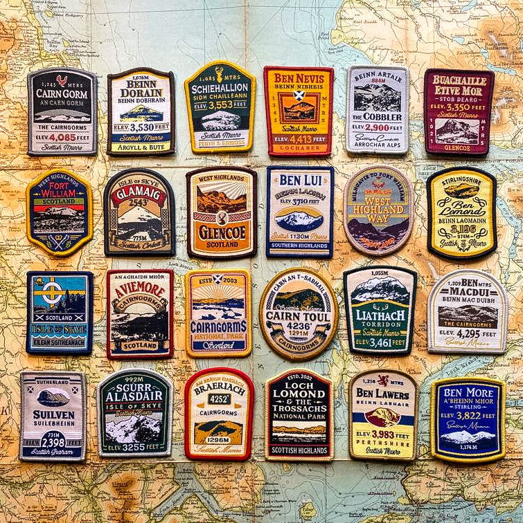 Full set of 24 Scottish Mountain patches laid out – retro whisky label woven patch collection, £40 saving