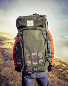 Hill walker with Lake District patches on outdoor gear in mountains – Crinkle Crags patch included