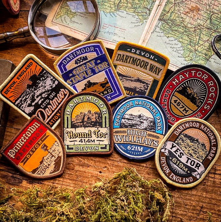 Dartmoor patches collection laid out – Princetown patch included in retro woven patch set