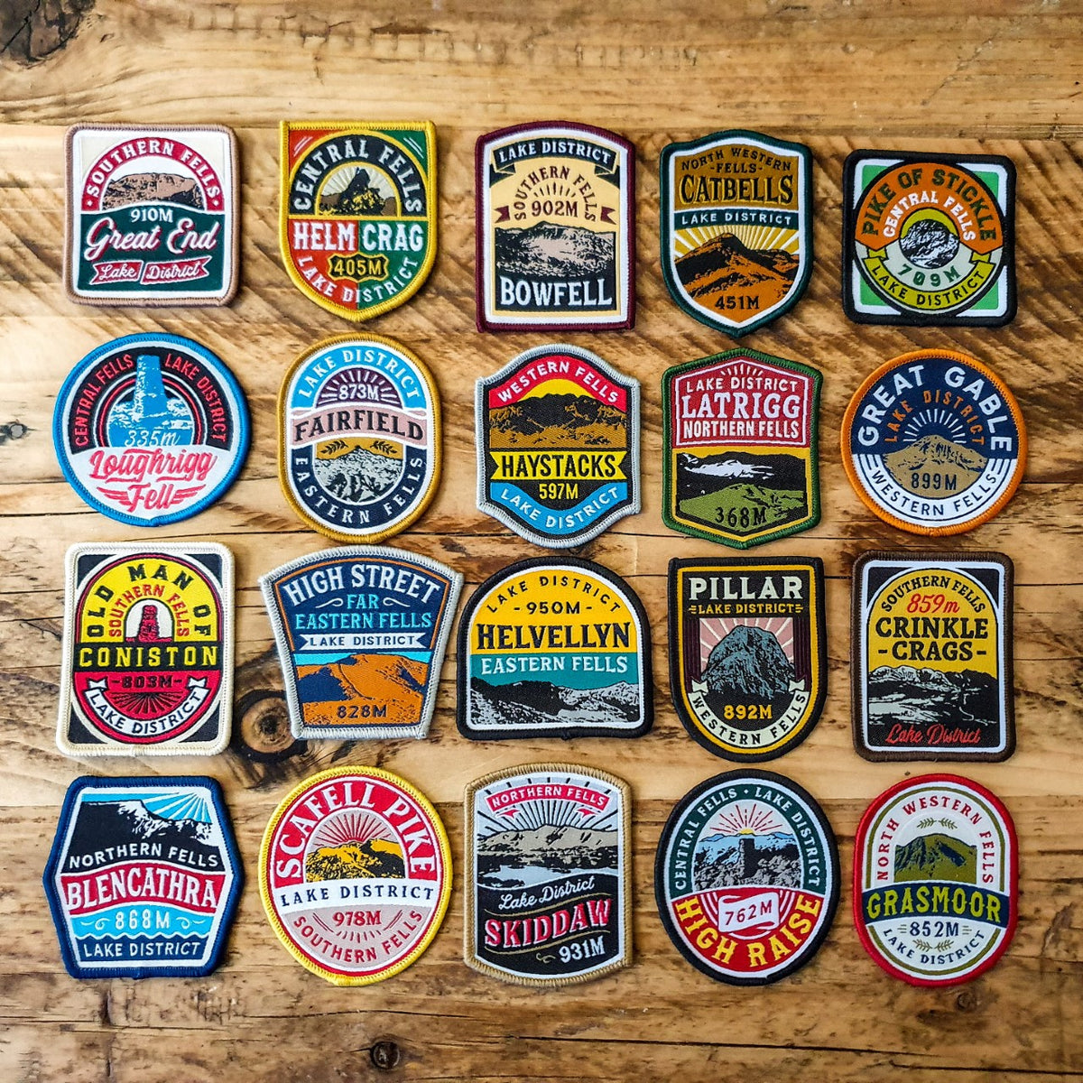 Full set of 20 Lake District Fells patches laid out – retro woven hiking patch collection