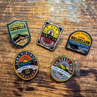 Lake District Fells enamel pins on backing cards – Old Man of Coniston pin displayed in collection