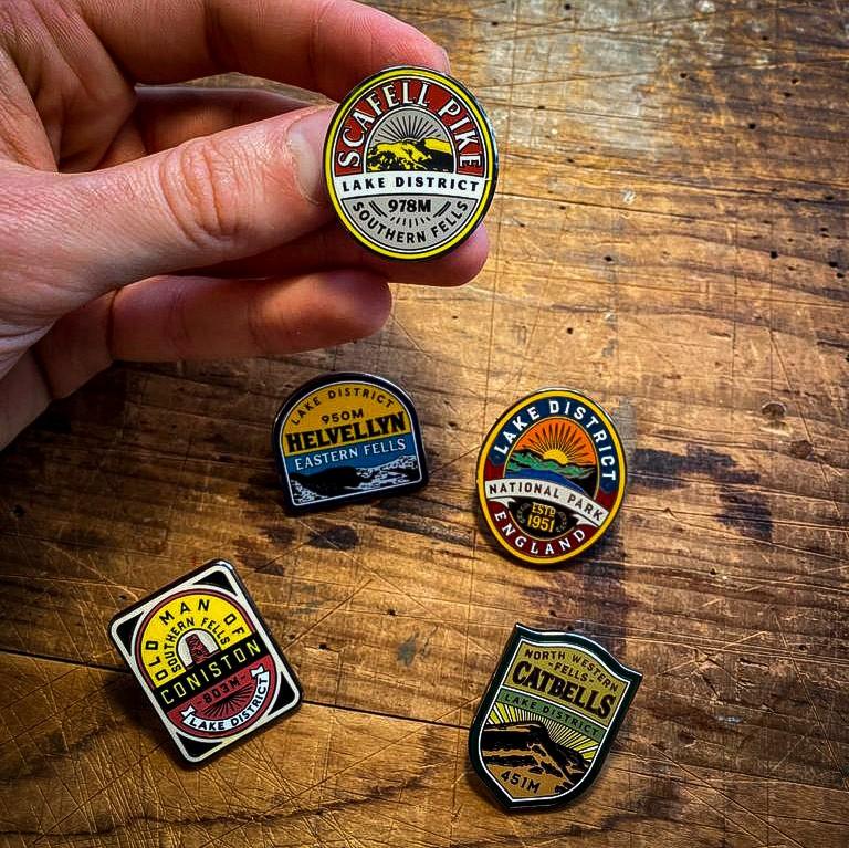Lake District Fells enamel pins in hand – set of five pins, vintage pump clip design