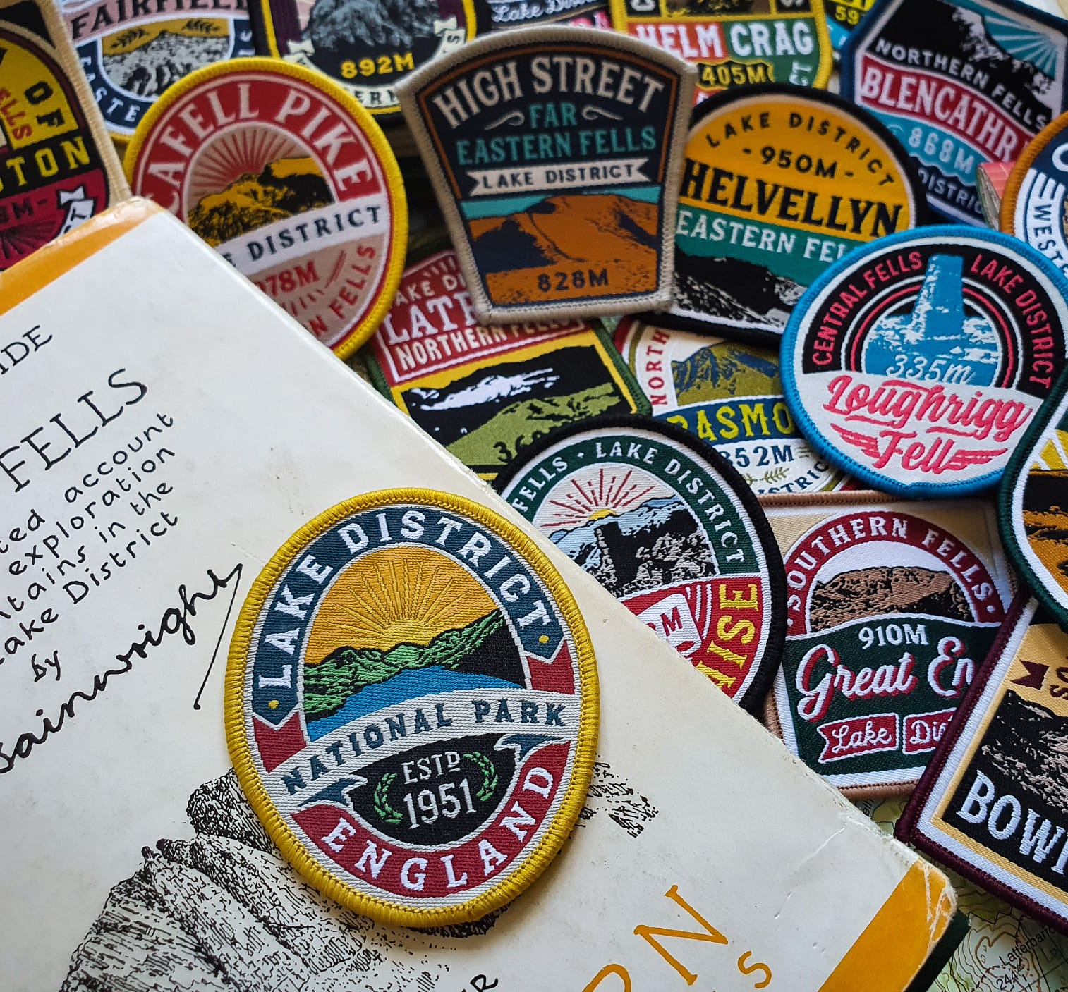 Lake District National Park patch displayed on a vintage book – retro outdoor woven patch