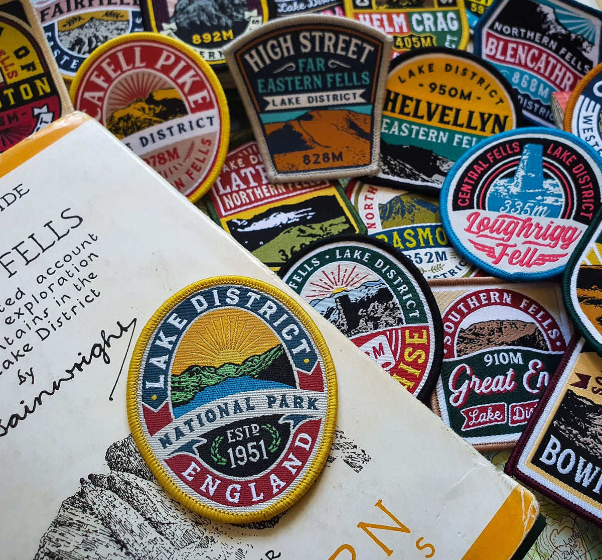 Lake District National Park patch displayed on a vintage book – retro outdoor woven patch