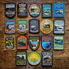 Full set of 18 Peak District patches laid out – Bakewell patch included in collection