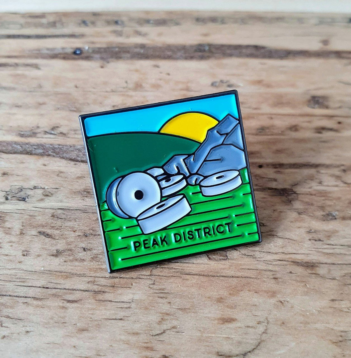 Peak District National Park enamel pin – old millstones design, 23mm, letterpress backing card