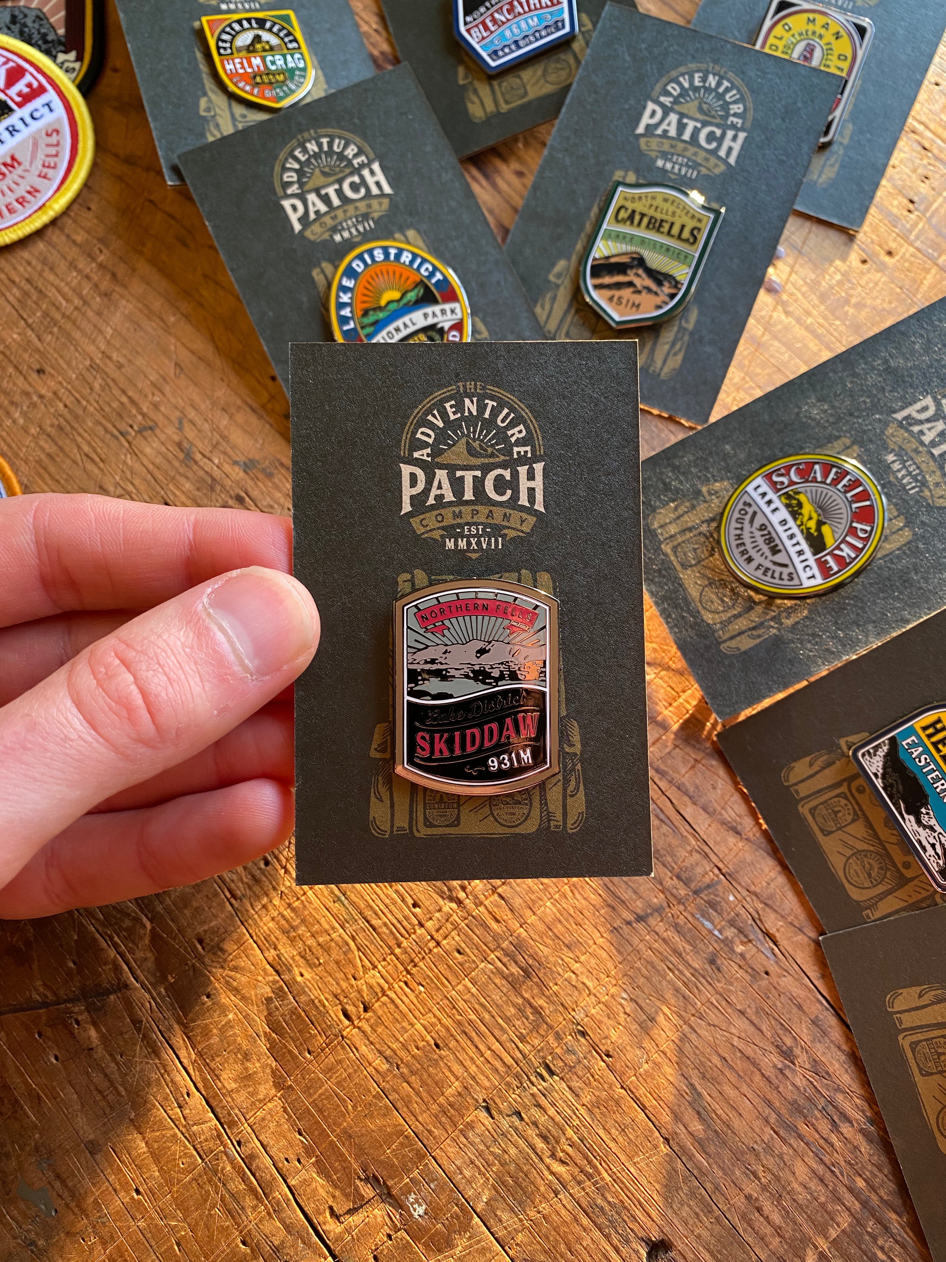 Skiddaw enamel pin displayed on backing card – Lake District Fells hard enamel pin