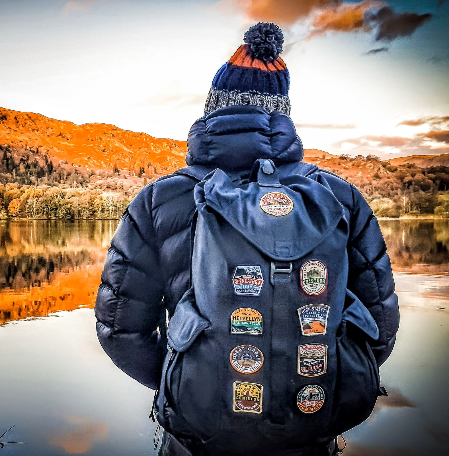 Woven patches pinned to a rucksack – Lake District hiking patches displayed on outdoor pack